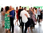 Guests slow dancing at a wedding