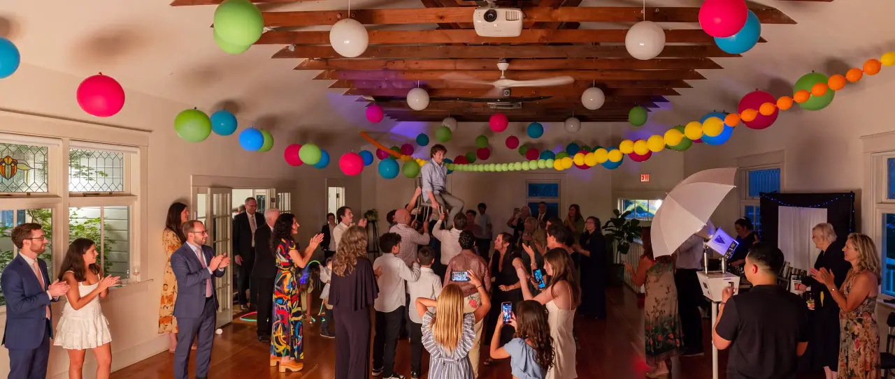 An elegant evening reception under soft bistro lights, creating a warm and sophisticated atmosphere