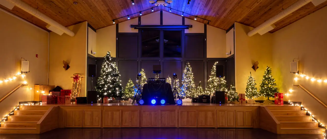 A festive winter school dance decorated with Christmas lights at the Philomath Scout Lodge